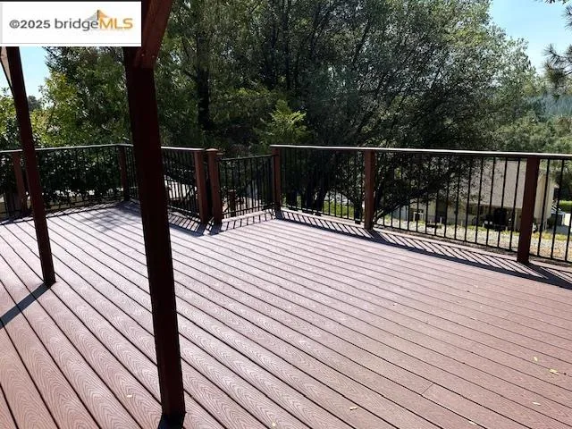 a view of deck with wooden floor and outdoor seating