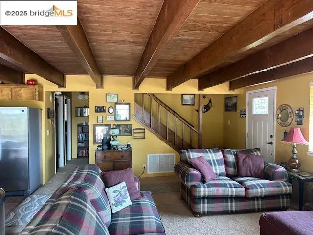 a living room with furniture and a couch