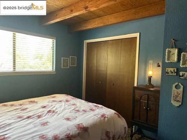 a bedroom with a bed and dresser