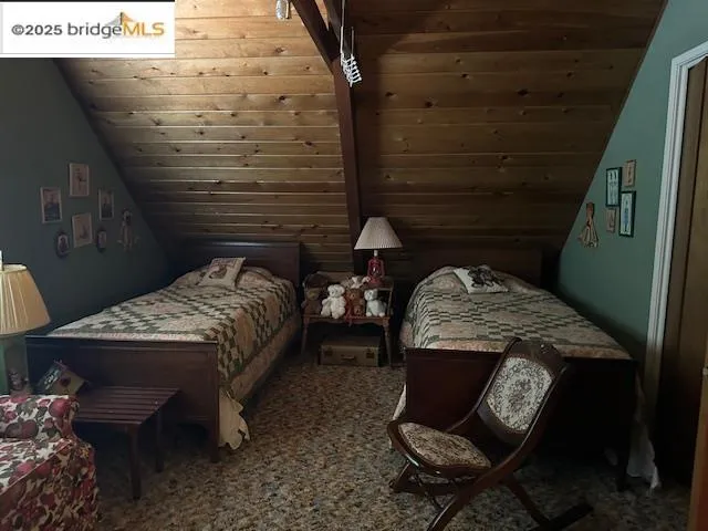 a bed sitting in a room next to a window