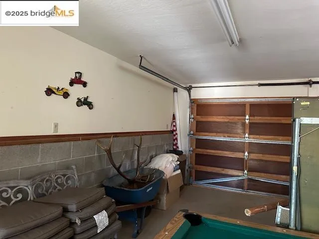 a room with gym equipment and a potted plant