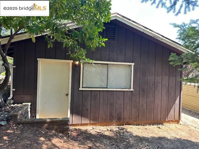 a house view with a backyard space