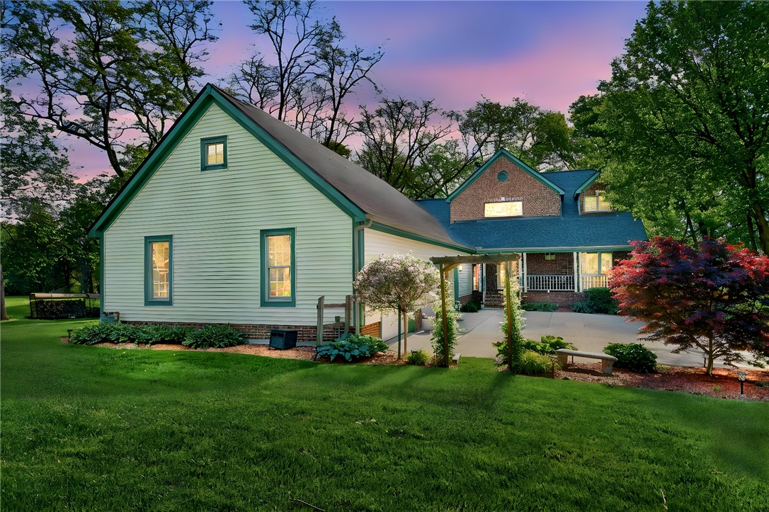 This residence showcases classic architecture with mature landscaping and a welcoming entrance.