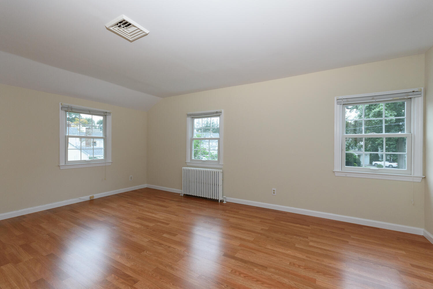 15 Miles Road Darien, CT 06820 - Photo 11 of 23 a view of an empty room with wooden floor and a window
