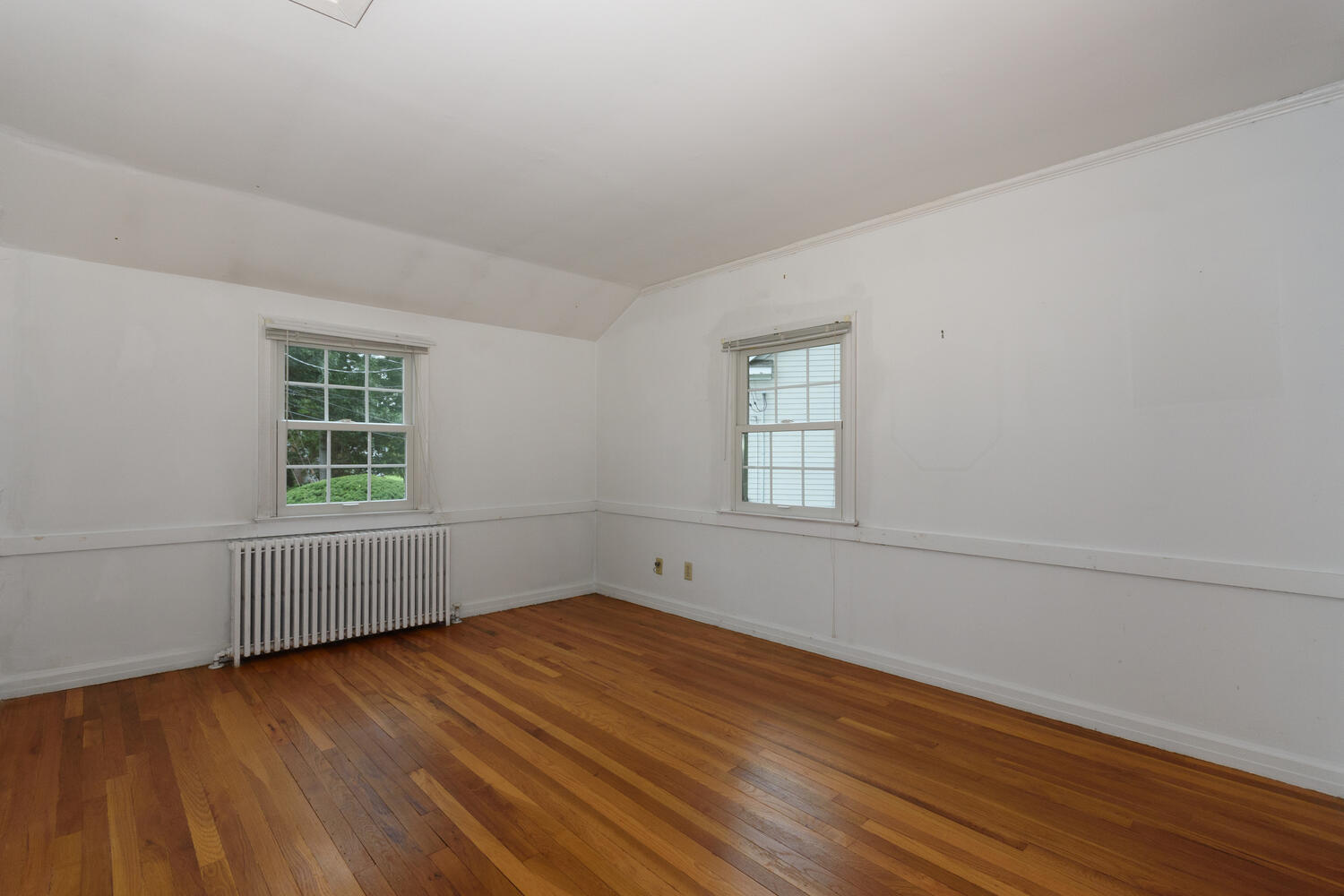 15 Miles Road Darien, CT 06820 - Photo 13 of 23 wooden floor in an empty room with a window