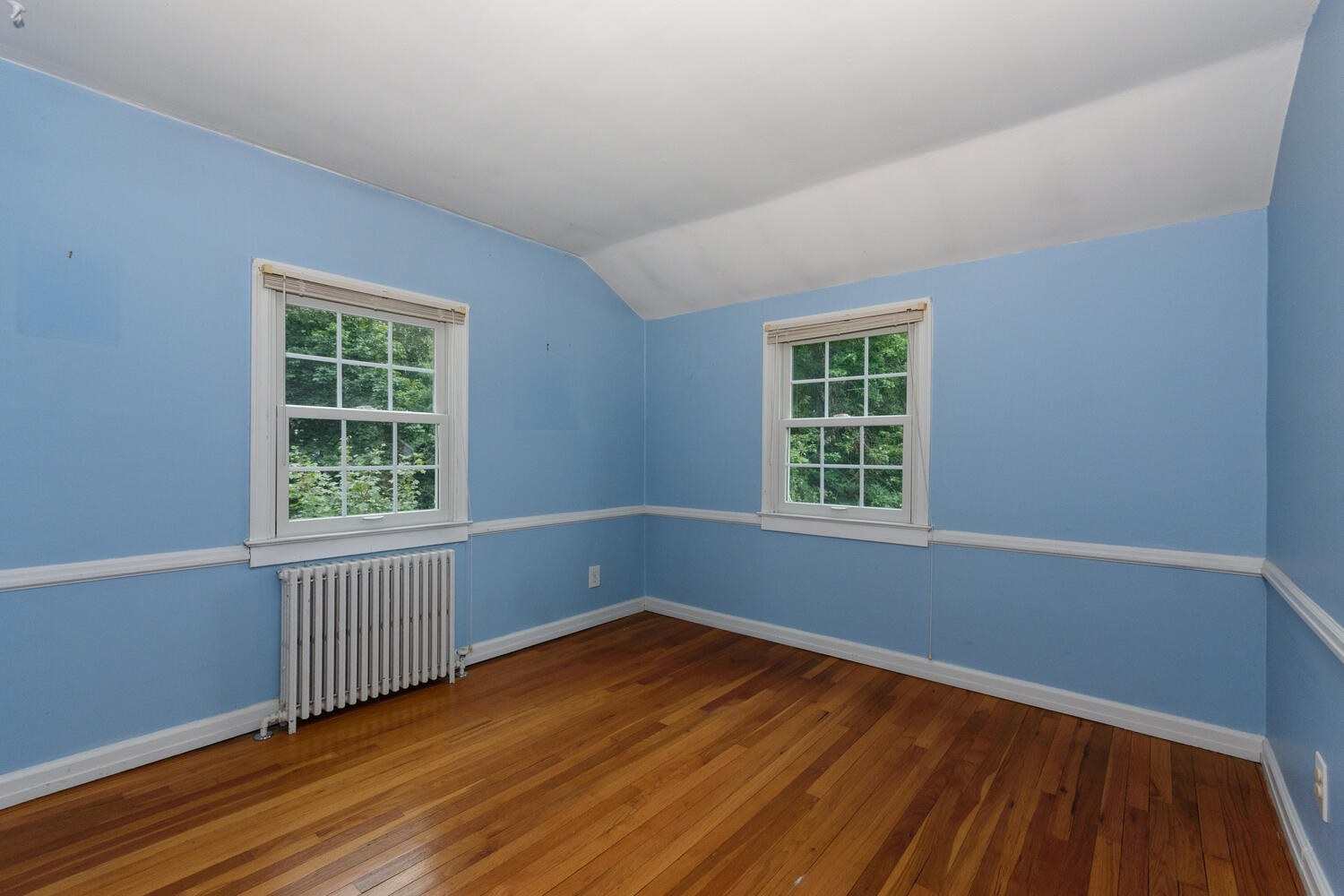 15 Miles Road Darien, CT 06820 - Photo 14 of 23 a view of an empty room with wooden floor and a window