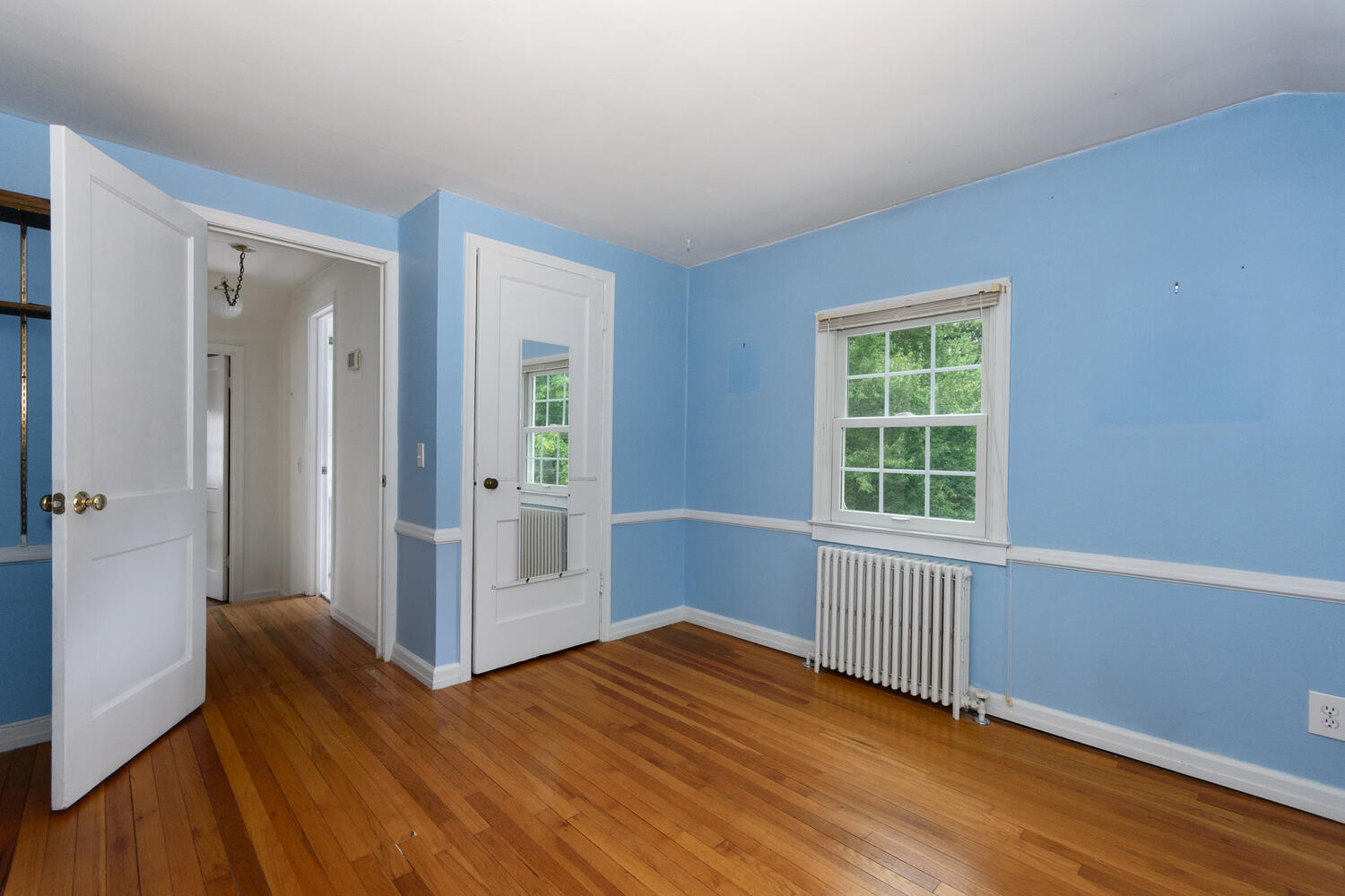 15 Miles Road Darien, CT 06820 - Photo 15 of 23 an empty room with wooden floor and windows