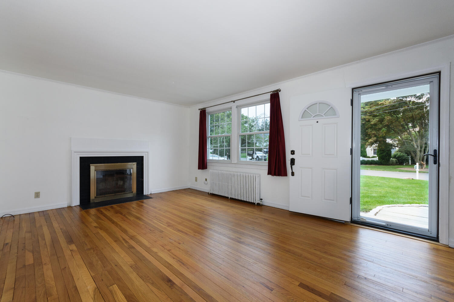 15 Miles Road Darien, CT 06820 - Photo 4 of 23 a view of an empty room with glass door and wooden floor