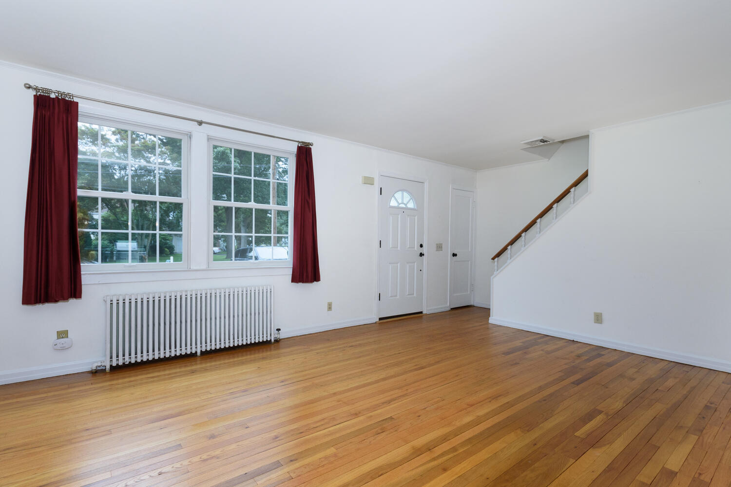 15 Miles Road Darien, CT 06820 - Photo 5 of 23 a view of an empty room with wooden floor and a window