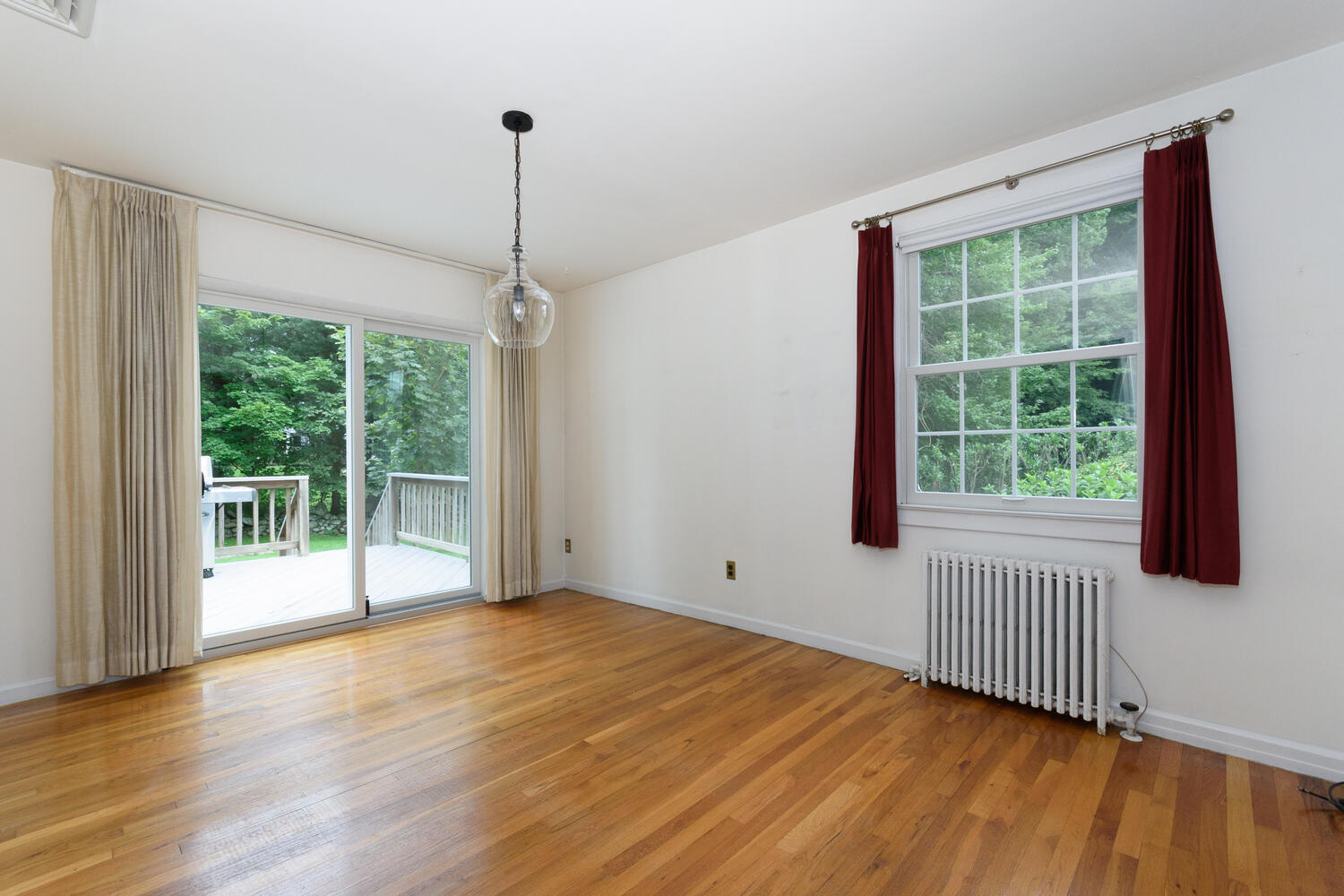 15 Miles Road Darien, CT 06820 - Photo 6 of 23 a view of an empty room with wooden floor and a window