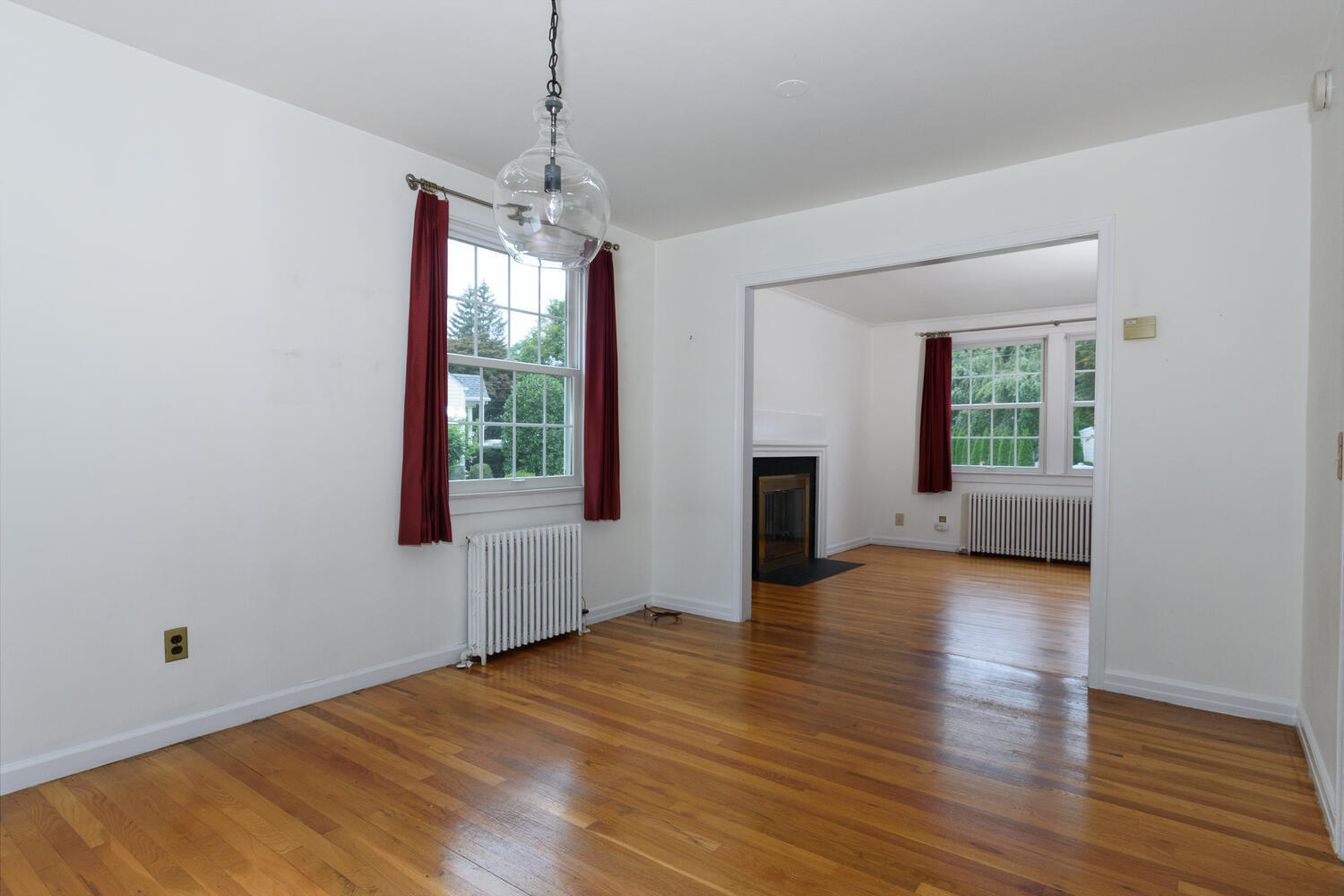 15 Miles Road Darien, CT 06820 - Photo 7 of 23 a view of an empty room with window and wooden floor