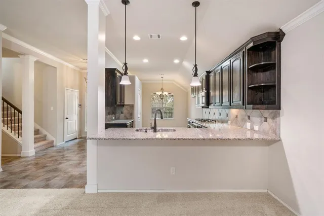 a bathroom with a sink a large mirror and vanity