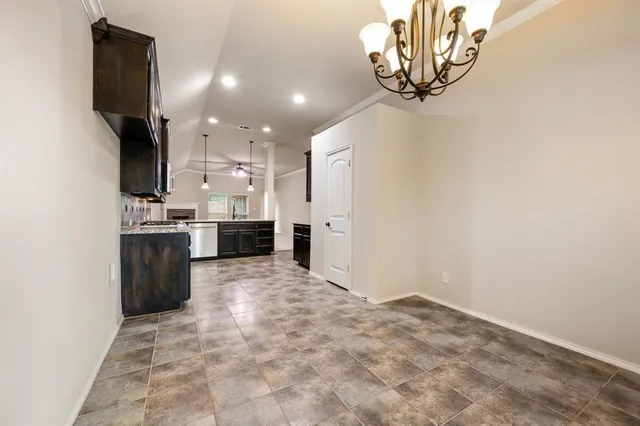 a view of a kitchen with a sink and cabinets