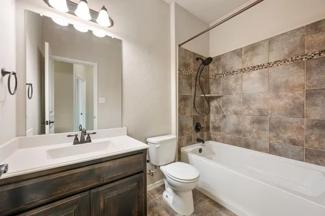 a bathroom with a sink a toilet and a bathtub