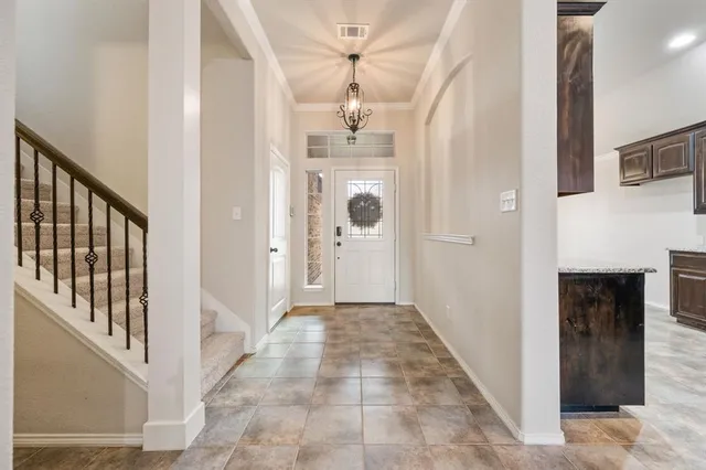 a view of a hallway view with staircase