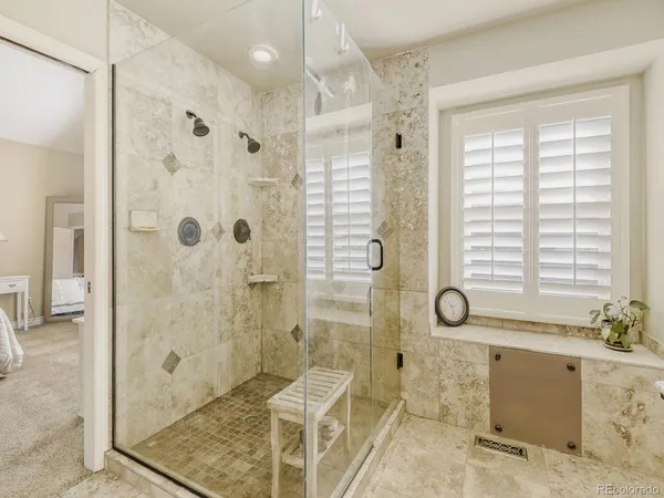 a bathroom with a shower and a sink