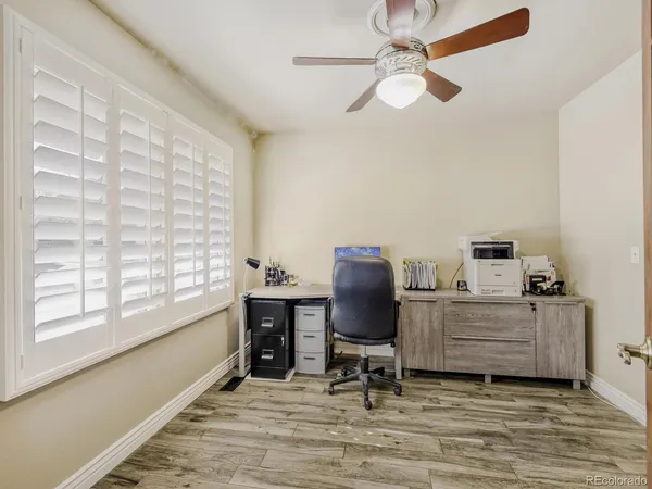 a workspace with furniture and a window