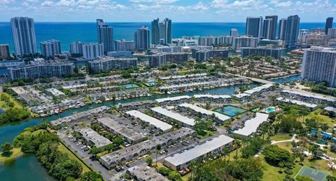 a living room with furniture and a dining table with outer view