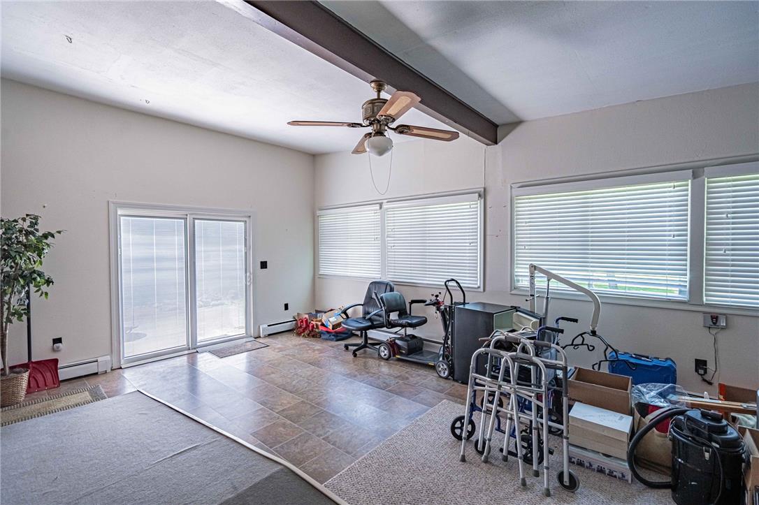 579 Cherry Road Northampton, PA 18067 - Photo 24 of 57 A spacious sunroom features exposed ceiling beams and abundant natural light from large windows and sliding glass doors also with handicap access.