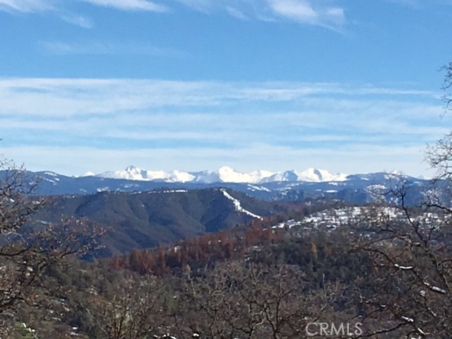 a view of a bunch of mountain and covered with trees