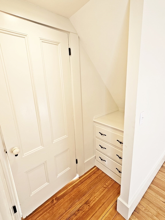 11 Channing Street, Unit 2 Newton, MA 02458 - Photo 17 of 27 a view of a bedroom with wooden floor