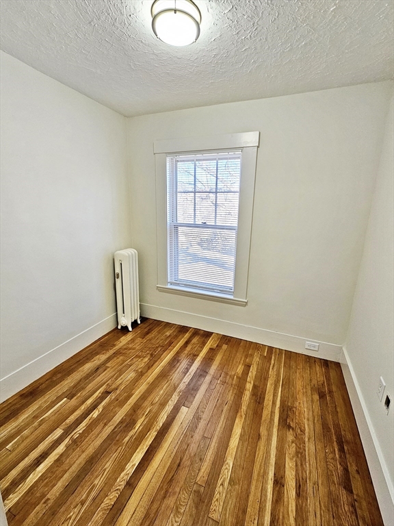 11 Channing Street, Unit 2 Newton, MA 02458 - Photo 20 of 27 a view of an empty room and window