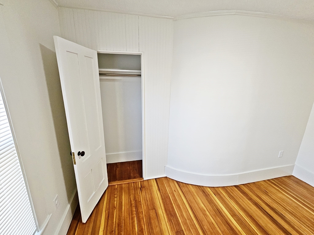 11 Channing Street, Unit 2 Newton, MA 02458 - Photo 23 of 27 a view of a room with wooden floor and entryway