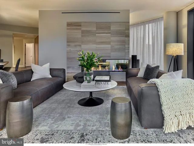 a living room with furniture and a table