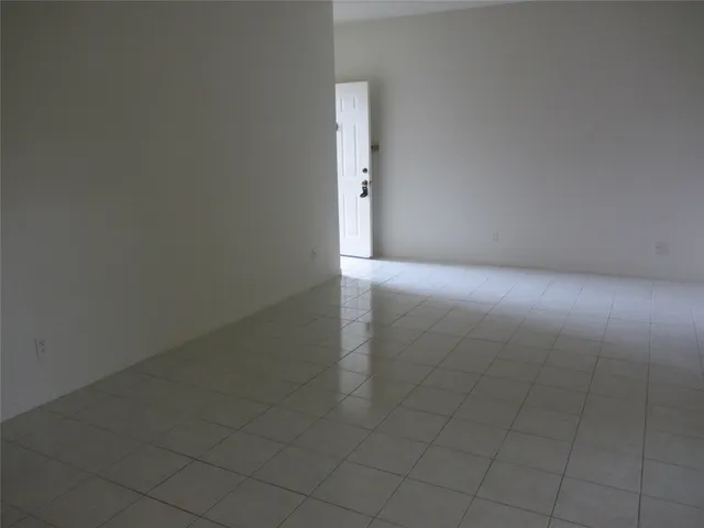 a view of a hallway with a glass door