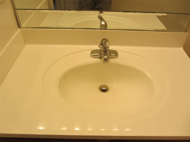 a view of a kitchen with refrigerator and stove