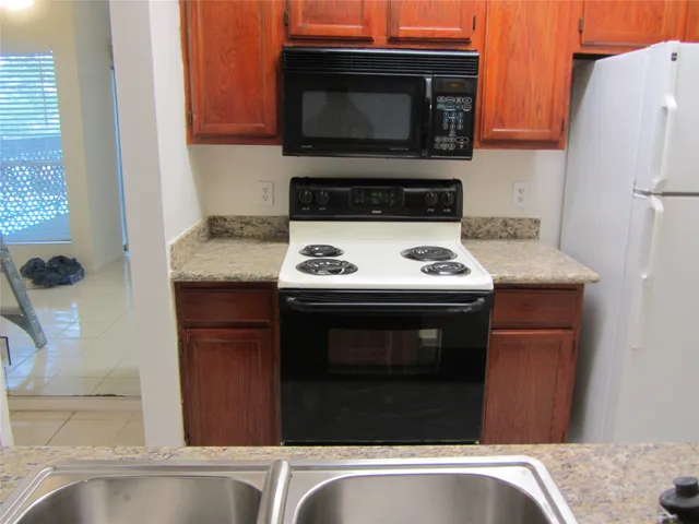 a kitchen with a stove and a microwave