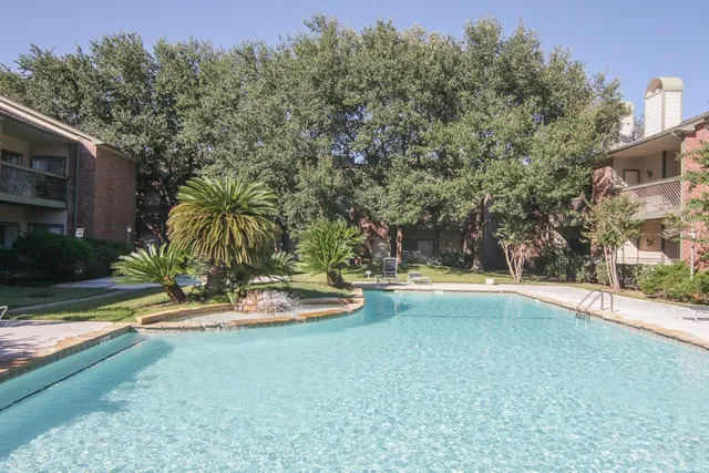 a view of a swimming pool with an outdoor space and seating area