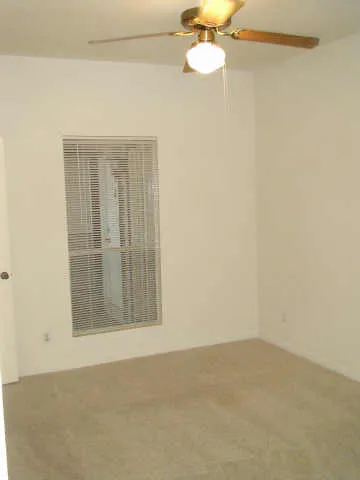 a bathroom with a shower a toilet and a sink