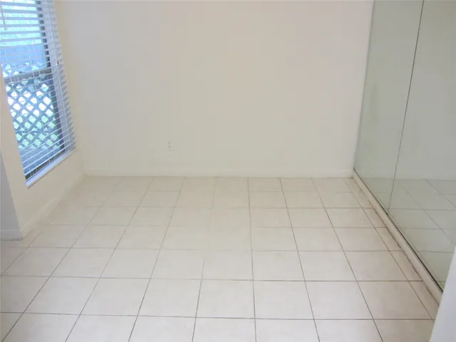 an empty room with a bathroom