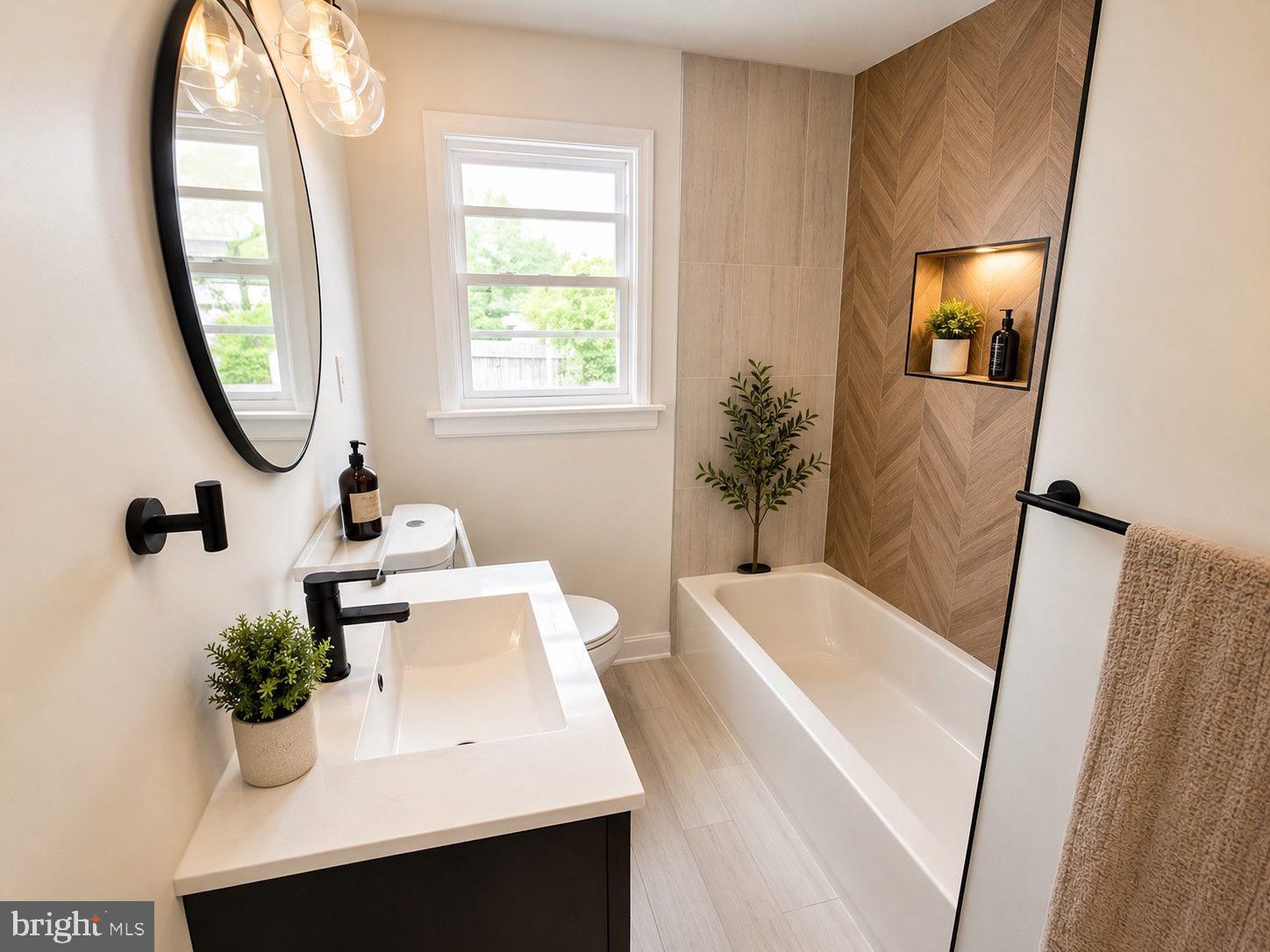 710 East Gibbsboro Road Lindenwold, NJ 08021 - Photo 16 of 21 a bathroom with a sink a mirror and a bathtub