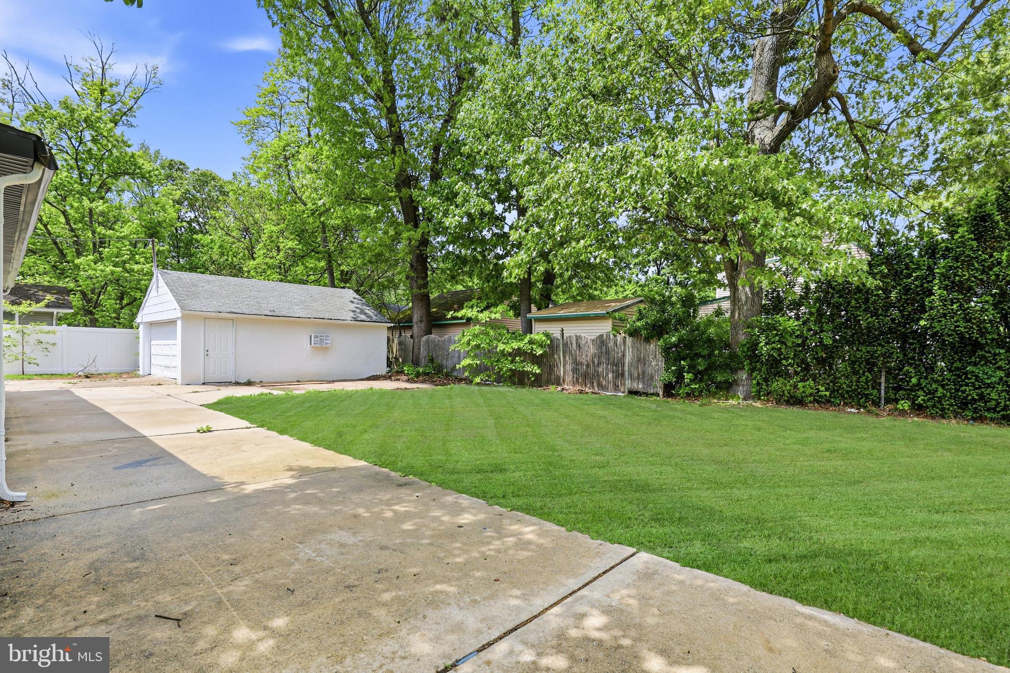 710 East Gibbsboro Road Lindenwold, NJ 08021 - Photo 20 of 21 a front view of a house with a yard and a garage