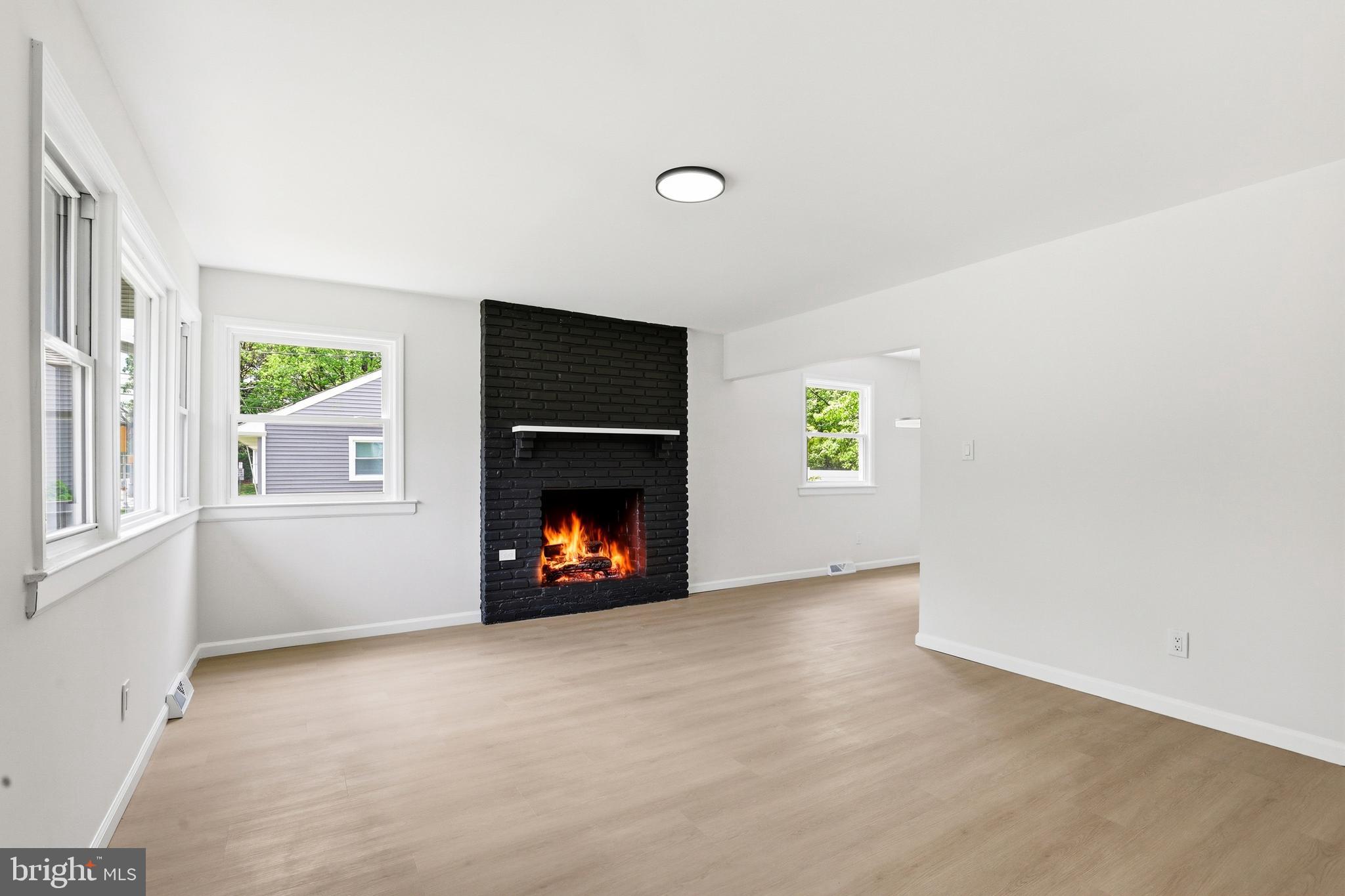 710 East Gibbsboro Road Lindenwold, NJ 08021 - Photo 9 of 21 an empty room with windows and fireplace