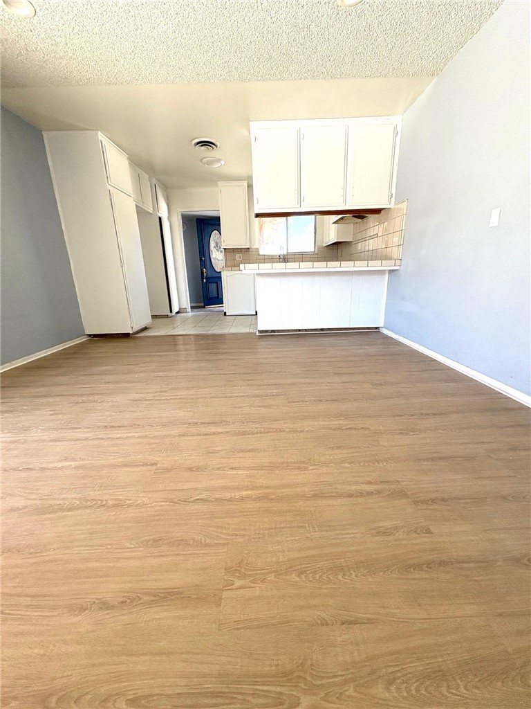 504 Heyer Street Lancaster, CA 93534 - Photo 3 of 8 a view of a room with wooden floor