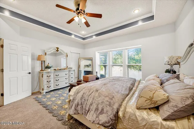 a bed room with a bed and a large window