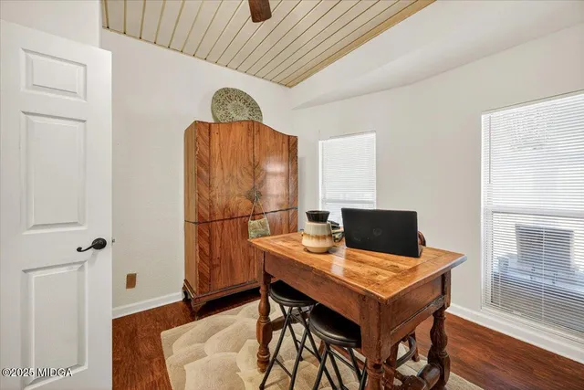 a workspace with furniture and wooden floor
