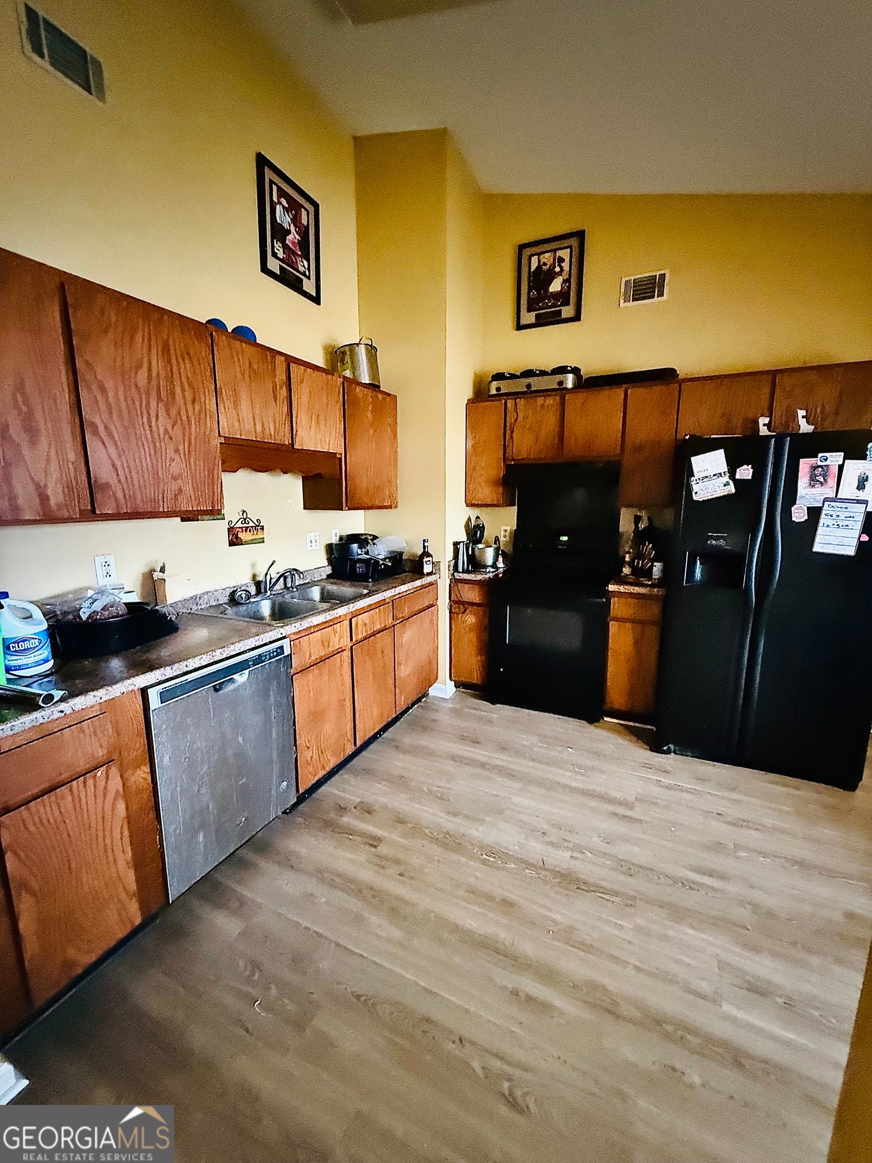 212 Dunmurry Place Warner Robins, GA 31093 - Photo 11 of 21 a large kitchen with stainless steel appliances granite countertop a stove a sink and a refrigerator