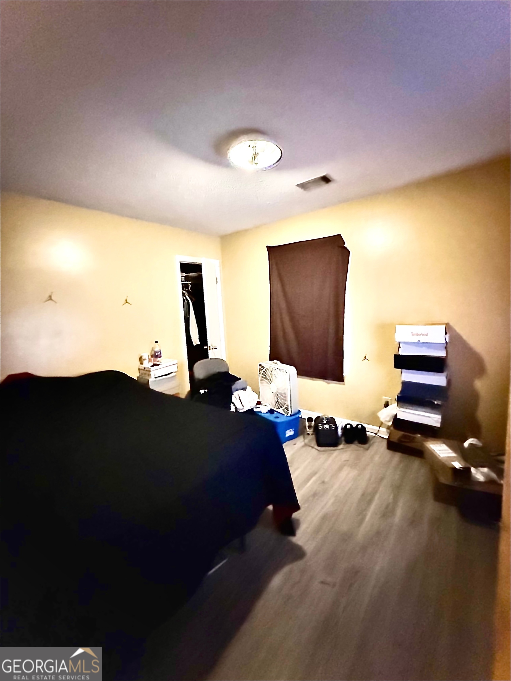 212 Dunmurry Place Warner Robins, GA 31093 - Photo 16 of 21 a bedroom with bed and a flat screen tv