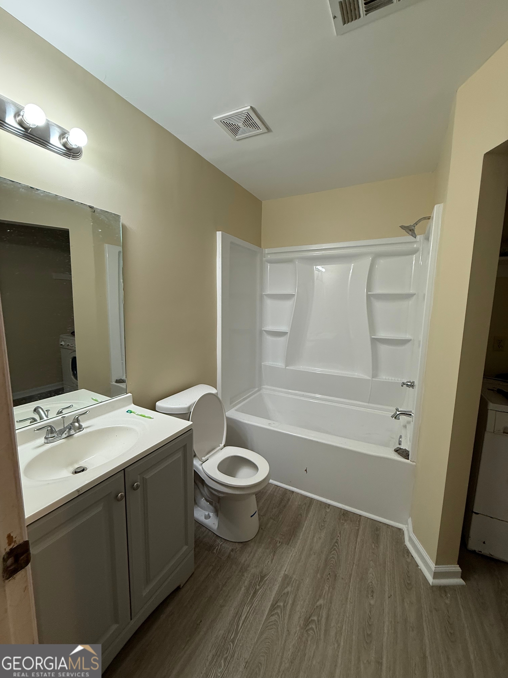 212 Dunmurry Place Warner Robins, GA 31093 - Photo 17 of 21 a bathroom with a sink a toilet and shower
