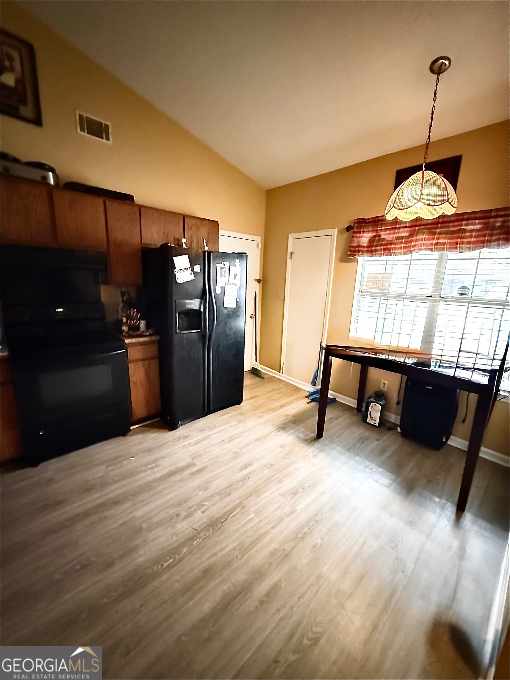 212 Dunmurry Place Warner Robins, GA 31093 - Photo 9 of 21 a room with wooden floor and furniture
