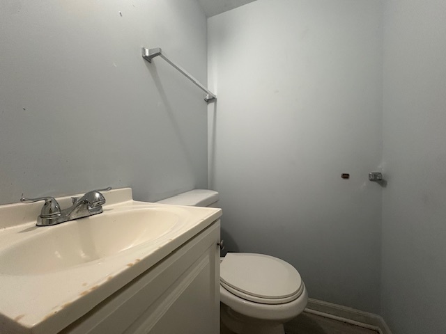 6542 South Carpenter Street Chicago, IL 60621 - Photo 12 of 17 a bathroom with a sink a toilet and a mirror