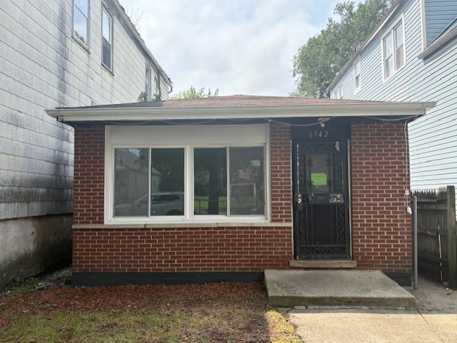 6542 South Carpenter Street Chicago, IL 60621 - Photo 16 of 17 a view of a house with a window
