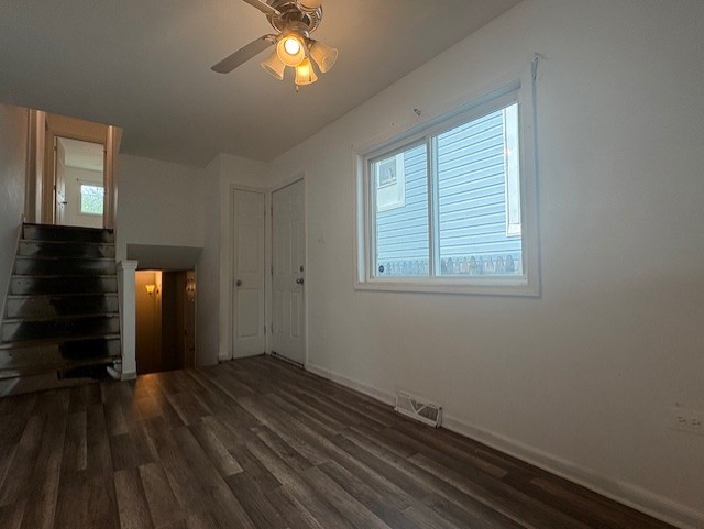 6542 South Carpenter Street Chicago, IL 60621 - Photo 4 of 17 a view of a room with wooden floor and a window