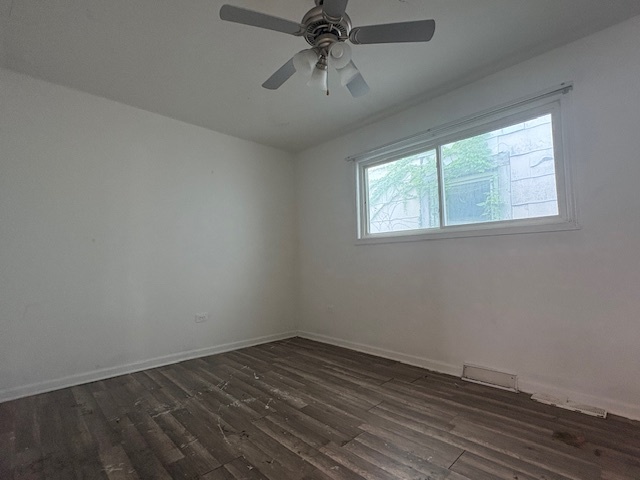 6542 South Carpenter Street Chicago, IL 60621 - Photo 6 of 17 wooden floor in an empty room with a window