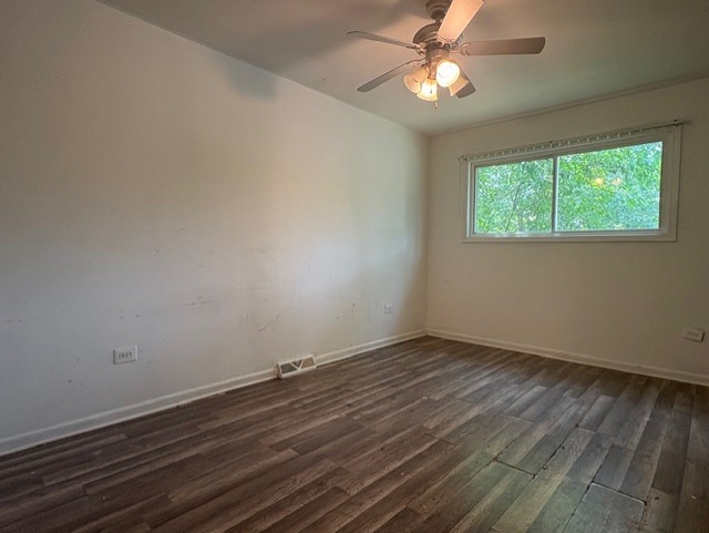 6542 South Carpenter Street Chicago, IL 60621 - Photo 9 of 17 wooden floor in an empty room with a window
