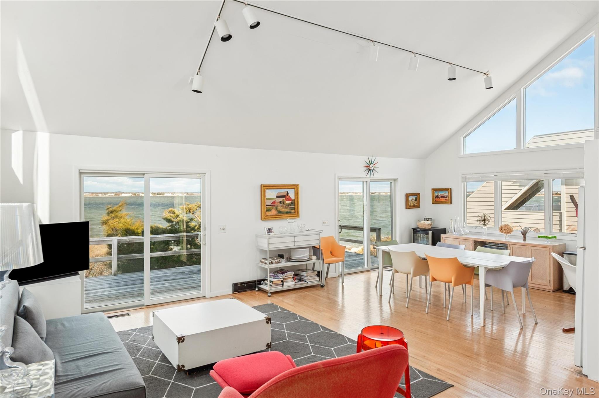 630 Dune Road Westhampton, NY 11978 - Photo 3 of 14 a living room with furniture large window and livingroom